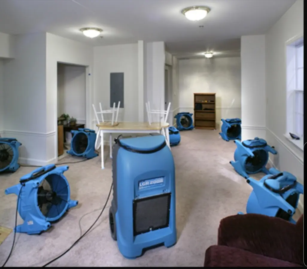 Air movers and dehumidifier setup for Water Damage Restoration in Fairmount